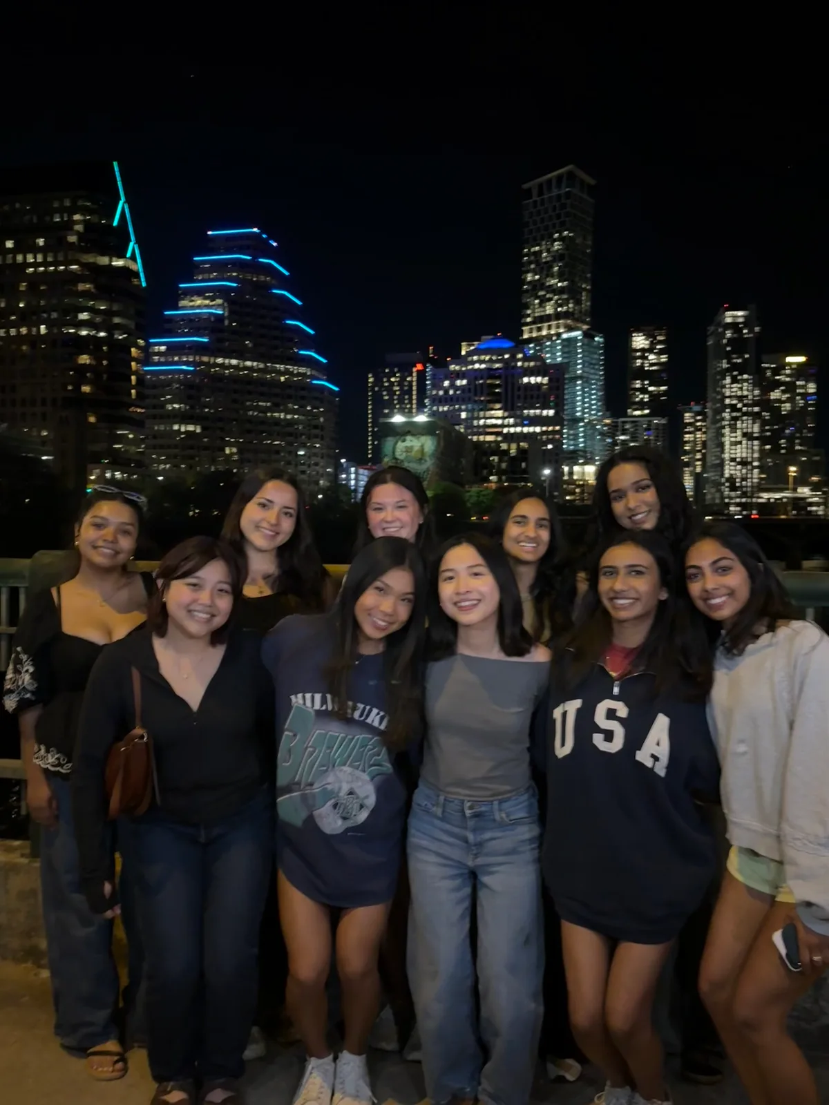 TASK members in front of the Austin skyline at night on the TASK Trip.